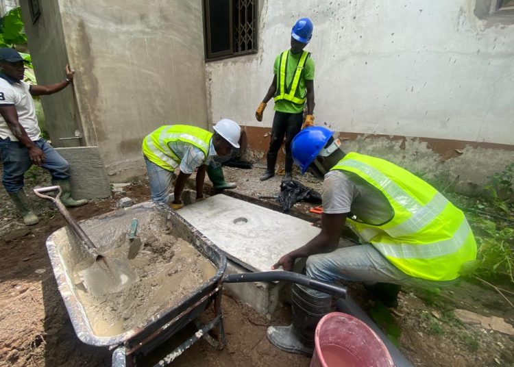Dreamhouse workers constructing a digester